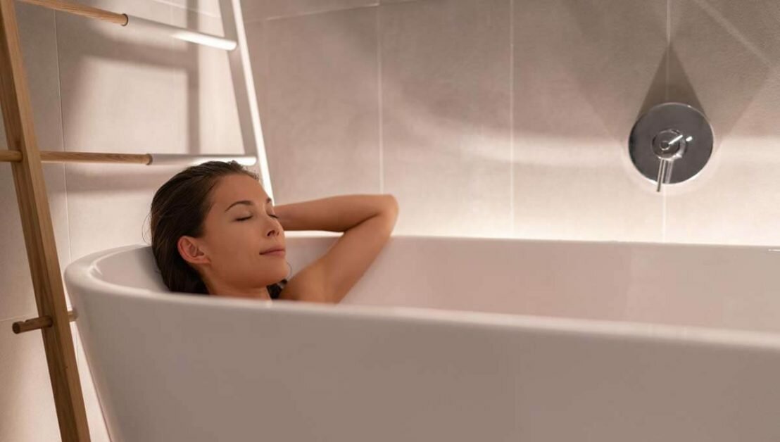 woman relaxing in home spa taking a bath